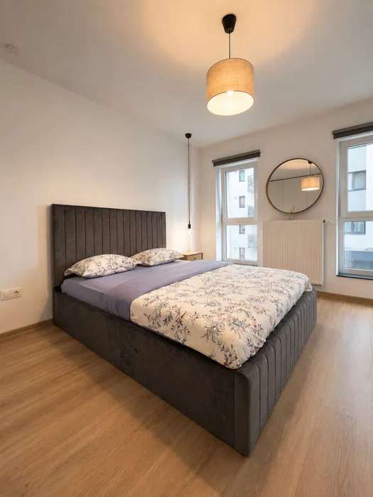 A room with a bed and a window — apartment in Brașov