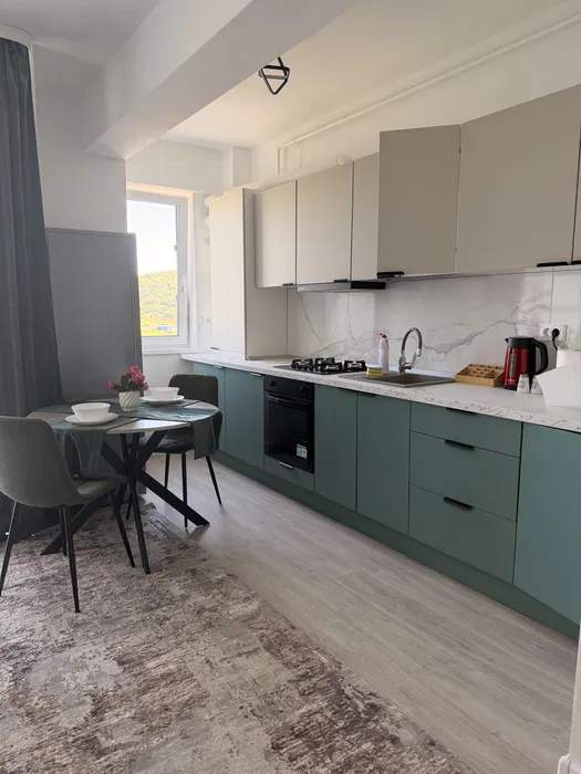 A small, clean and well-organized kitchen with a window