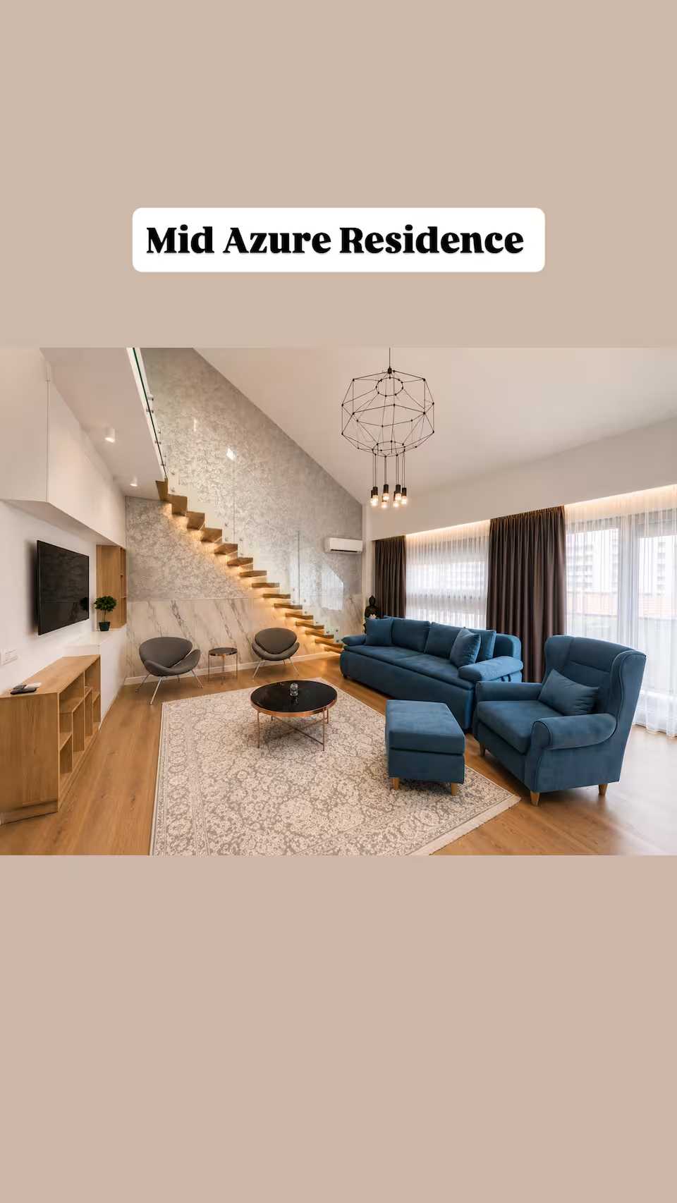 A living room with a blue sofa, a chair, a coffee table and a window — apartment in Oradea