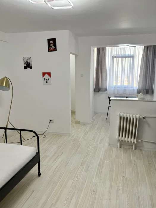 Room with bed and window.