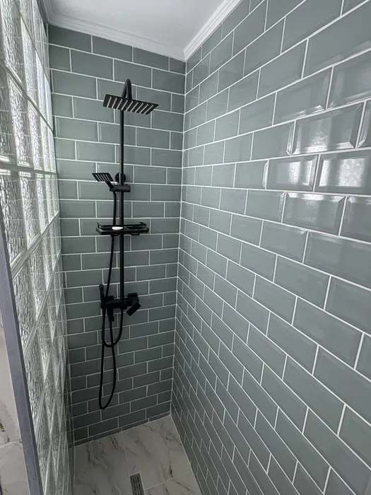 Bathroom with shower and window