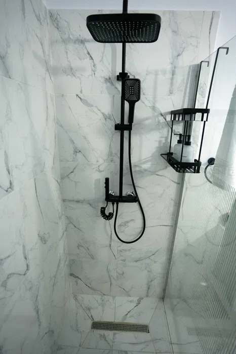 A bathroom with shower and toilet