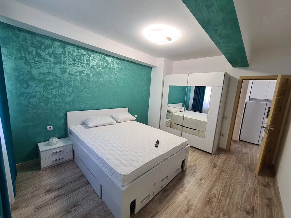Room with bed and mirror