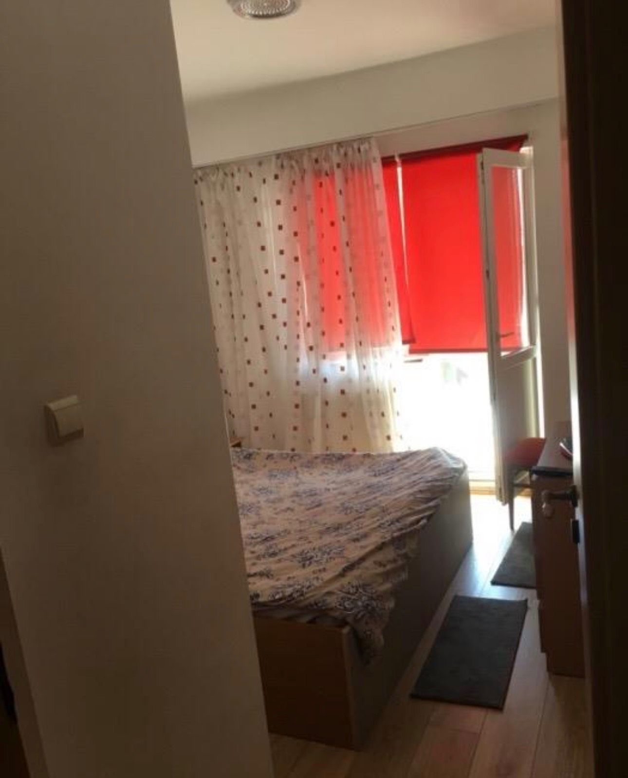 Room with bed and window.