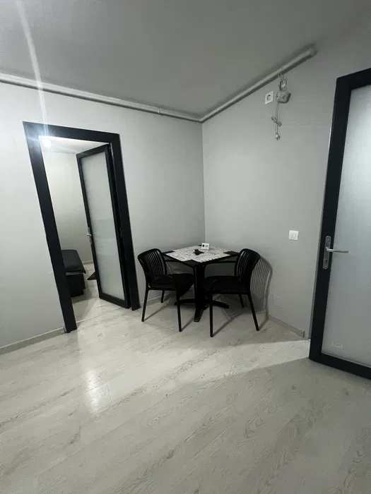 A small room with a table and chairs