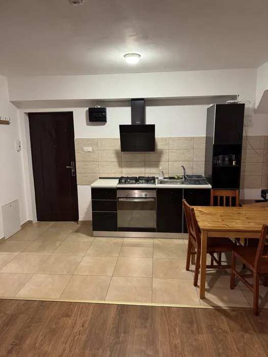 A kitchen with a oven and a table