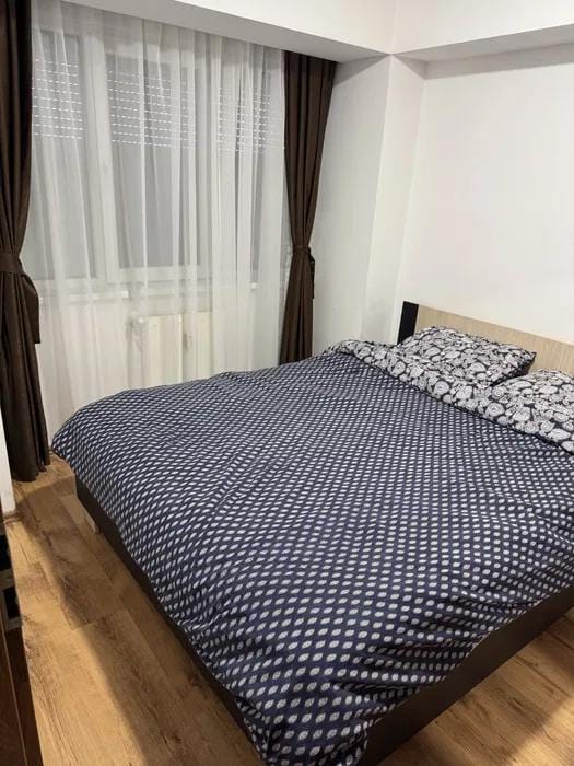 Room with bed and window.