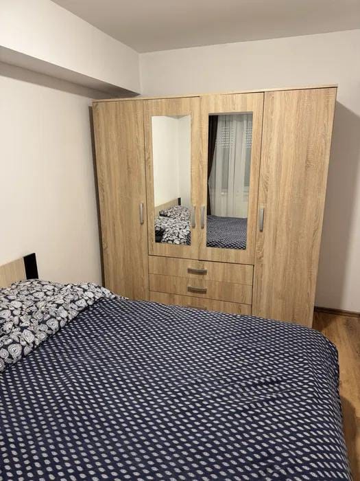 Room with bed and mirror