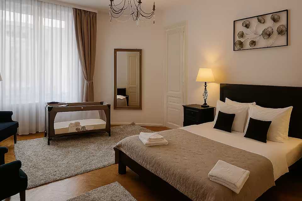 A room with a bed, a mirror and a window — apartment in Oradea