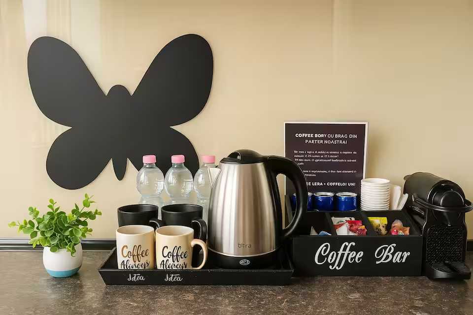 A cafe with a coffee machine and water bottles — apartment in Oradea